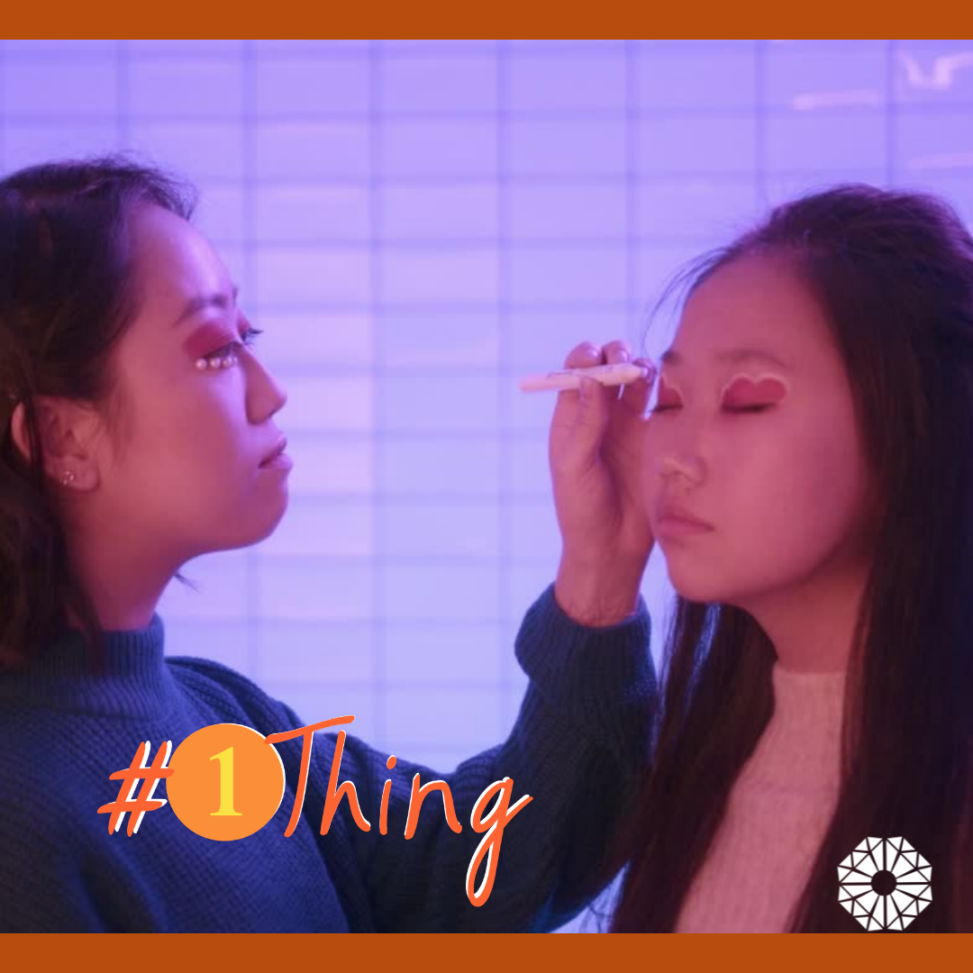 Person putting makeup on another person. #1Thing