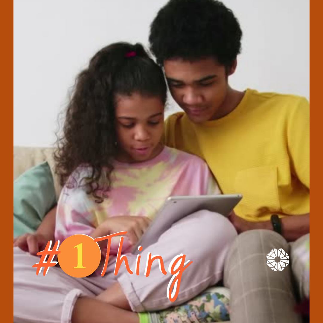 Older boy reading a book to a younger girl. #1Thing