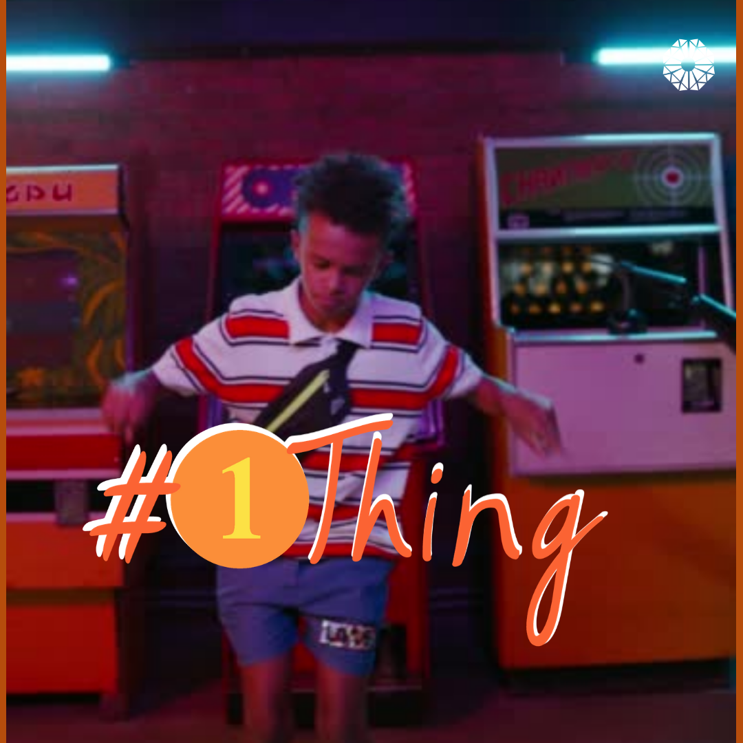 Young person dancing in an arcade. #1Thing