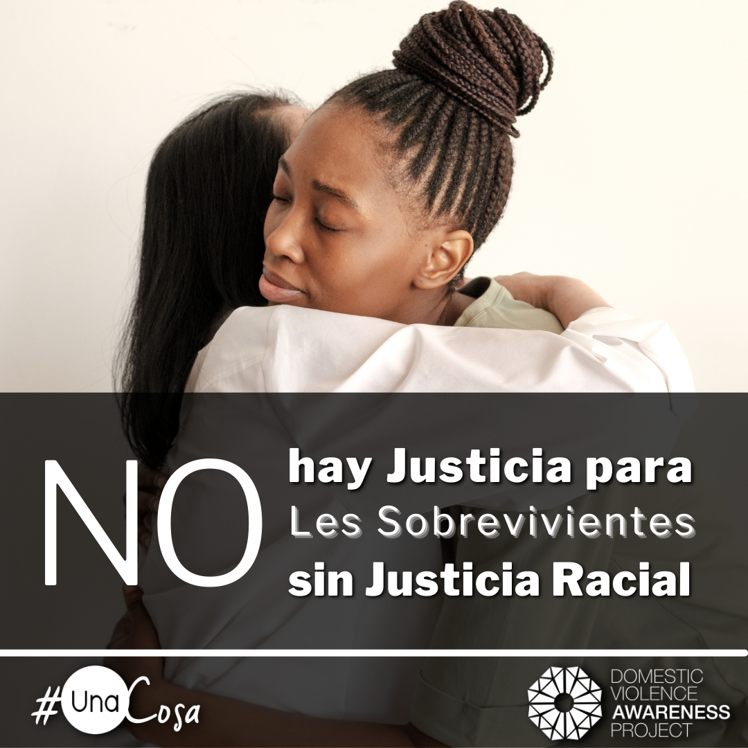 ​  No Survivor Justice without Racial Justice text in spanigh overtop of an image of 2 women hugging